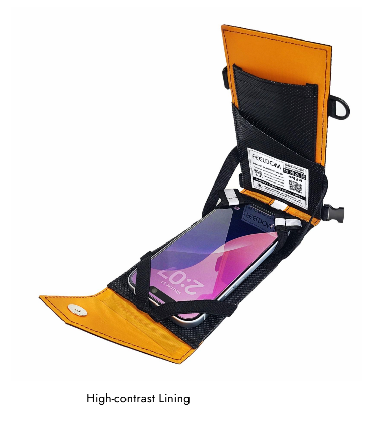 The exterior of the bag is black with an orange lining.